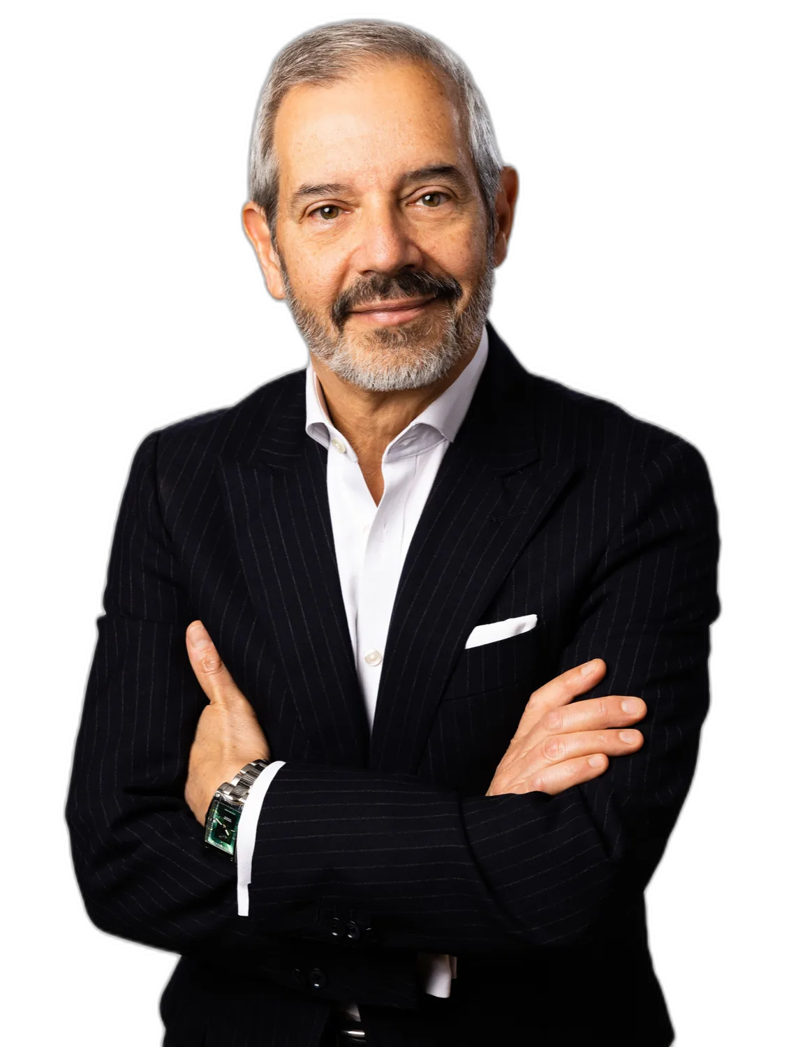 Luis M Garcia, media coach, in a dark suit with arms folded